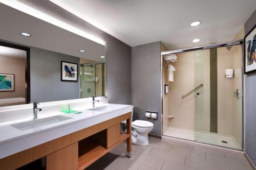 a bathroom with a sink and a shower and a toilet at Hyatt Place Provo in Provo