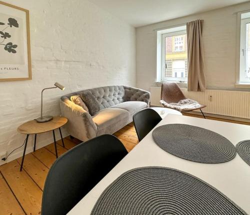 Una cama o camas en una habitación de Cozy & romantic apartment in the Heart of Aalborg