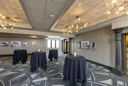 a room with two tables with candles on it at Hotel Maison Yakima Tapestry Collection by Hilton in Yakima