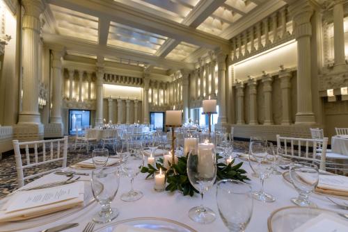 a large room with a table with glasses and candles at Hotel Maison Yakima Tapestry Collection by Hilton in Yakima