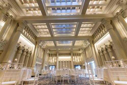 a room with tables and chairs in a building at Hotel Maison Yakima Tapestry Collection by Hilton in Yakima