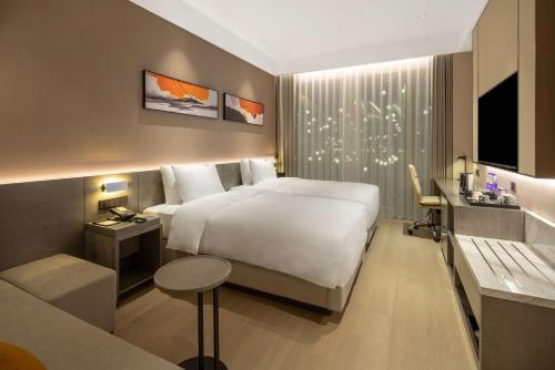 Cama o camas de una habitación en Hyatt Place Linyi People Square