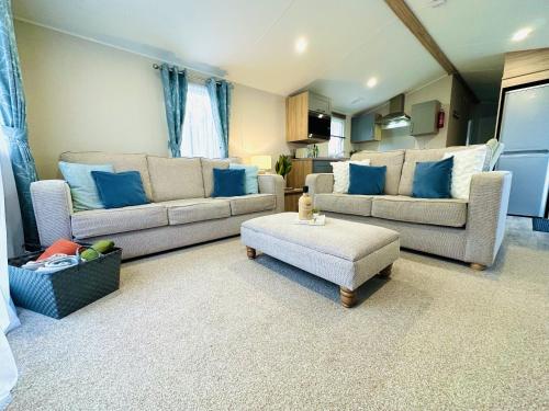 a living room with two couches and a coffee table at Beach Grove in Scarborough