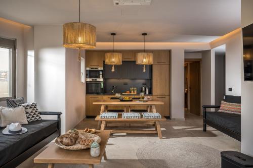 a living room with a couch and a table at Grace Villas Collection in Hersonissos