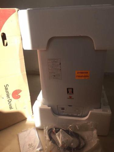 a close up of a sewing machine next to a box at un nouveau appartement avec un parking sur place in La Marsa