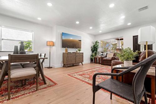 a living room with a table and chairs and a living room at Spacious Family 3BR Near Wynwood and Beach in Miami