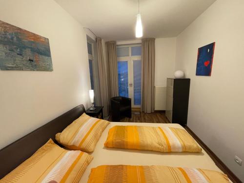 Postel nebo postele na pokoji v ubytování Štrbské Pleso rezidencia Oliver - apartmán 8
