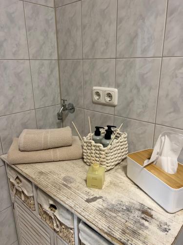 a bathroom with a counter with towels and a sink at LovelyDays in Edling