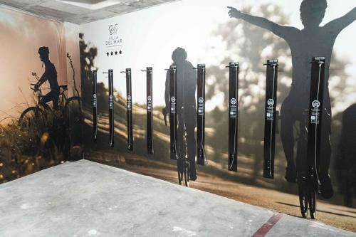 a wall with a shadow of a man on a bike at Hotel Villa del Mar in Benidorm