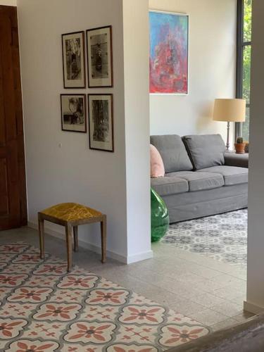 a living room with a couch and a table at 'Le Petit Clos Suites'- Charming Getaway on Leman Lake in Nyon