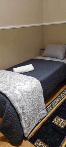 two beds sitting next to each other in a bedroom at Valia's house -Makri Village in Mákri