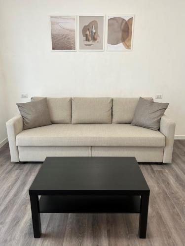 a living room with a couch and a coffee table at Exphome in Novate Milanese