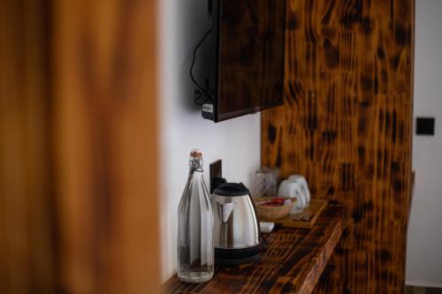 a counter top with two bottles of coffee on it at Dhiffushi Inn in Dhiffushi