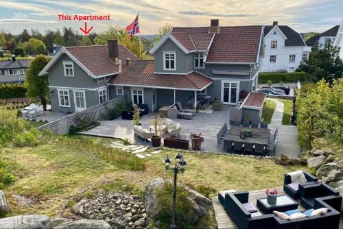 an aerial view of a house with a backyard at Mølleråsen Apartment in Sandefjord