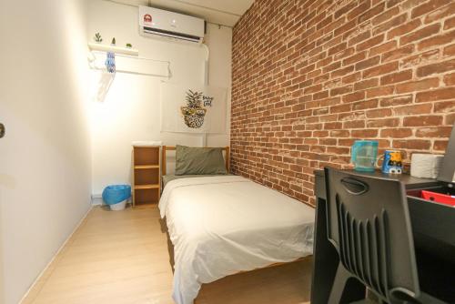 Ένα ή περισσότερα κρεβάτια σε δωμάτιο στο G Traveler Accommodation Homes 居旅舍