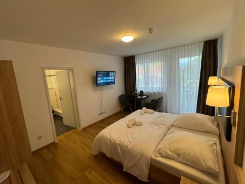 Ένα ή περισσότερα κρεβάτια σε δωμάτιο στο Motel Zur Dachsbaude