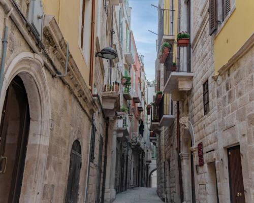 an alley in an old town with buildings at Luxury Way in Molfetta