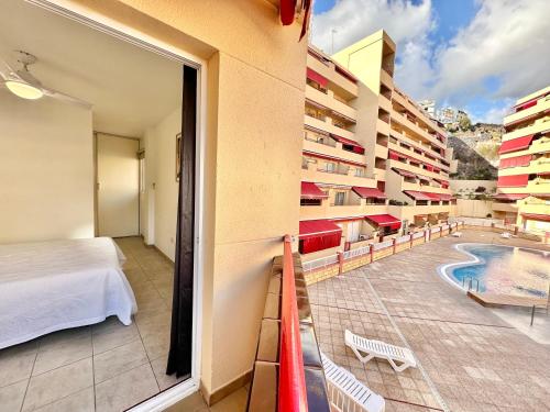 a hotel room with a view of a swimming pool at Kpaco Apartment in Puerto de Santiago