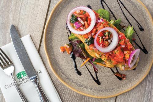 a plate of food with a salad on a table at Castle Oaks House Hotel in Limerick