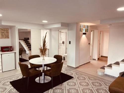 a living room with a table and chairs at Luxury apartament airport in Málaga