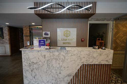a lobby with a marble counter in a store at Sultan Hamit Hotel in Istanbul