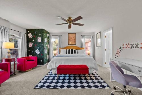 a bedroom with a bed and a ceiling fan at Pool - Life Size Games - 25 mins to Disney World in Davenport