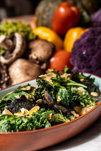 a bowl of vegetables and fruits on a table at Four Seasons Hotel Buenos Aires in Buenos Aires