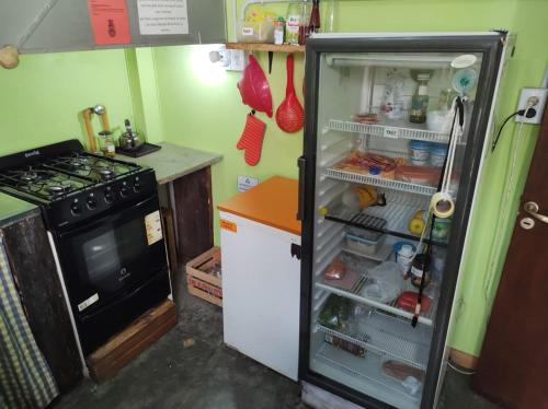 a refrigerator with its door open in a kitchen at Torre al Sur in Ushuaia