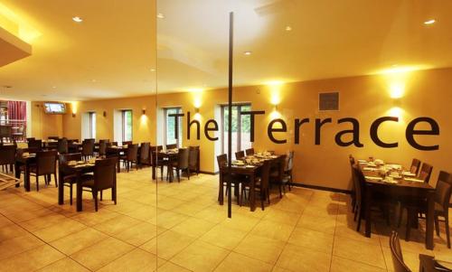 a restaurant with a sign that reads the terrace at Rosspark Hotel Kells in Ballymena