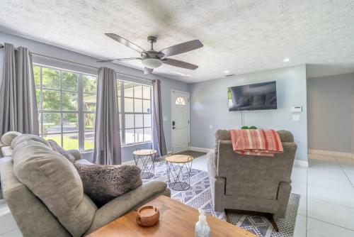 a living room with a couch and a chair at Beautiful Home in Naples with Huge Private Pool in Naples