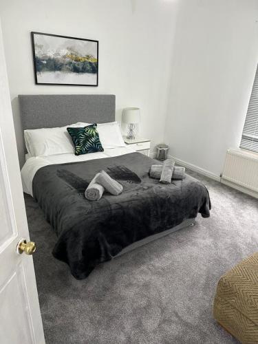 מיטה או מיטות בחדר ב-Cosy Nest Getaways