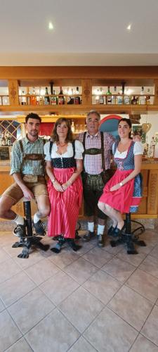 a group of people posing for a picture at Hotel Vigo in Vigo di Fassa