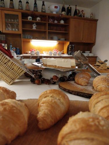 a table topped with lots of different types of bread at Hotel Vigo in Vigo di Fassa