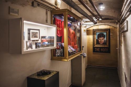 a hallway with a room with pictures on the wall at The Circus Hostel in Berlin