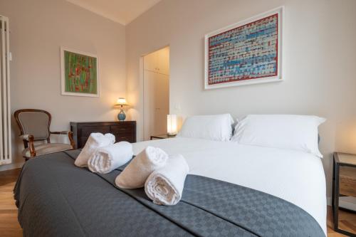 a bedroom with a bed with towels on it at Top View Luxury apartment Piazza del Popolo in Rome