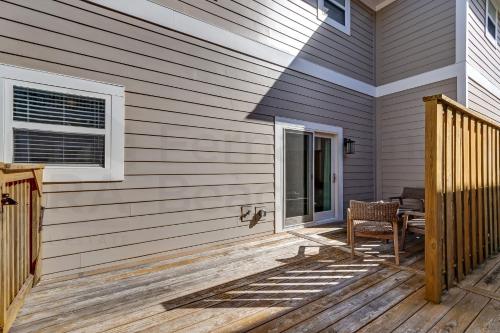 a porch of a house with a chair and a window at 2505B W, 5th St condo in Fernandina Beach