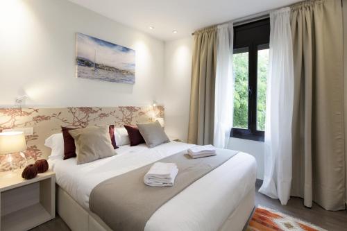 Postel nebo postele na pokoji v ubytování Mercedes Heritage Apartments