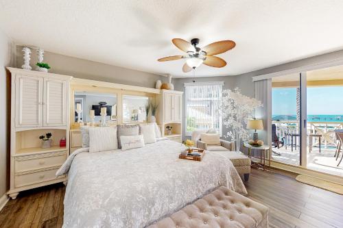 a bedroom with a bed and a ceiling fan at Mandalay Beach Club San Marco 403 in Clearwater Beach