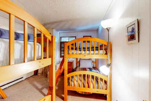 a room with two bunk beds and a ladder at Sea Wonder in Tillamook
