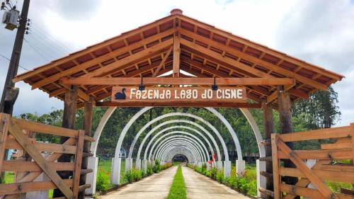 an archway with a sign that reads francisco illegal ob use at Fazenda Lago do Cisne in Itapoa