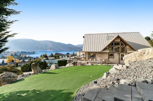 a house with a green lawn in front of it at Mac's Place in Manson