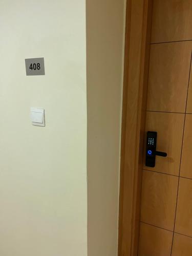 a door with a sign that says on it at DAMAC Luxury new 1 bedroom apartment in Amman