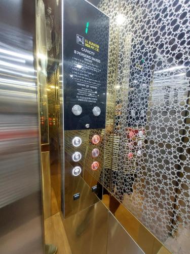 a glass wall with a bunch of buttons on it at HOMEWOOD SUITES in Jaipur