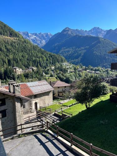 a view of a village with mountains in the background at Casa Francesca in Ponte di Legno