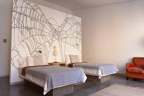 Cama ou camas em um quarto em Hotel Cosijo - San Jeronimo Tlacochahuaya