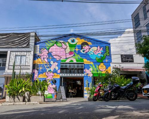a building with a mural on the side of it at Elemont Hotel in Medellín