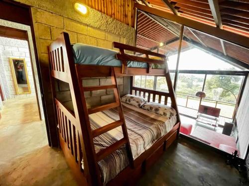 a bedroom with two bunk beds in a room at Chalet Zen Bella Vista in Ángeles
