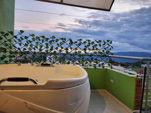 a bathroom with a toilet and a view of the ocean at Alojamiento, Penthouse, Dúplex, Spa in La Mesa