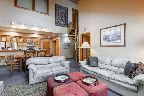 a living room with two couches and a kitchen at Townsend Place by Vail Realty in Beaver Creek