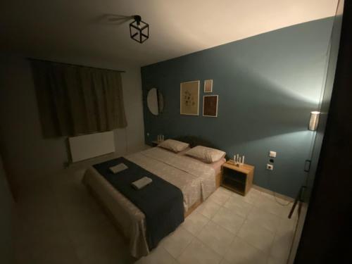 a bedroom with a bed and a small table at Cozy house in Xanthi